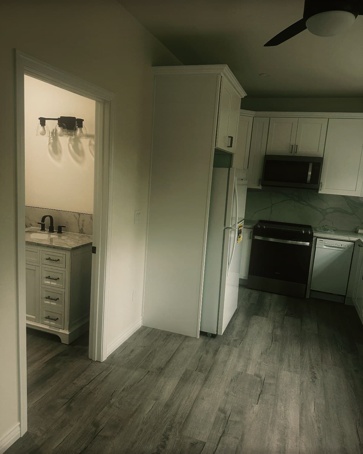 The finished interior of a detached accessory dwelling unit, looking through to the kitchen